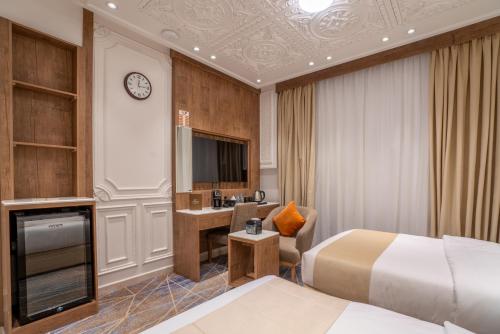 Postel nebo postele na pokoji v ubytování Nars Plus Al Naeem Hotel