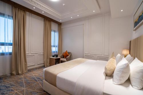 Postel nebo postele na pokoji v ubytování Nars Plus Al Naeem Hotel