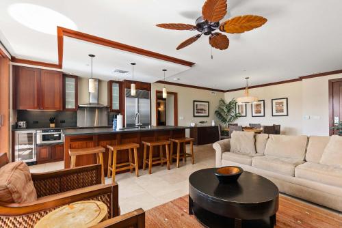 a living room and kitchen with a couch and a table at Gorgeous Villa in Ko Olina in Kapolei