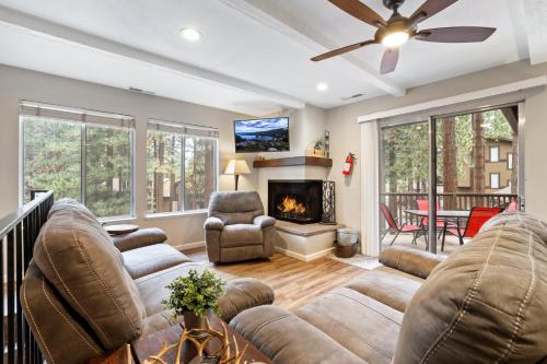 a living room with a couch and a fireplace at Family Fun Getaway - 3 Story Condo in Zephyr Cove