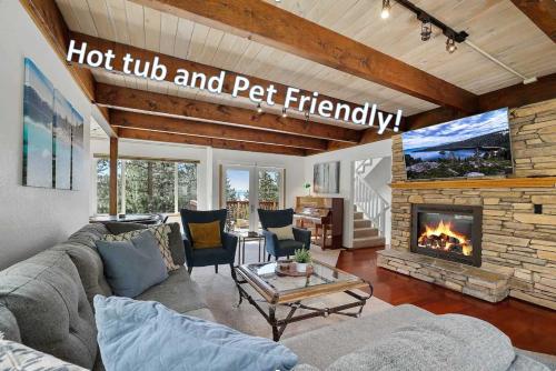 a living room with a couch and a fireplace at Hall Court Manor - Hot tub Pet Friendly Pool Table in Stateline