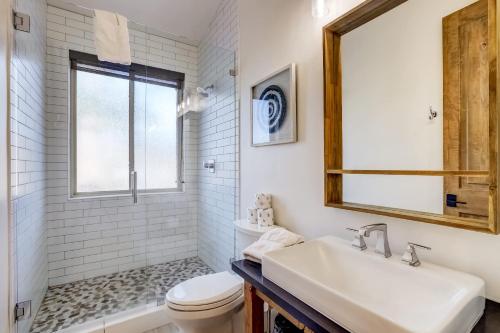 a white bathroom with a sink and a toilet at Luxe Mountain Chalet - Hot tub Man Cave Foosball Peloton in South Lake Tahoe