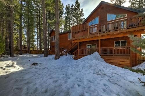 a log cabin in the woods in the snow at Luxe Mountain Chalet - Hot tub Man Cave Foosball Peloton in South Lake Tahoe
