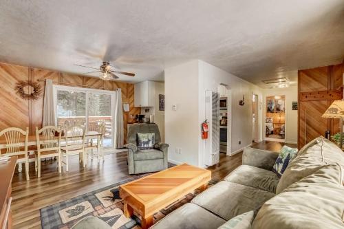 a living room with a couch and a table at Whispering Pines Cabin - Family & Pet Friendly Abode in South Lake Tahoe