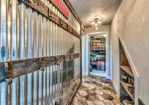 a home hallway with a large closet with wooden shelves at Heaven's Nest - the BEST views of Lake Tahoe in Stateline
