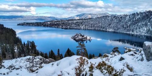 a view of a lake with snow on the ground at Heaven's Nest - the BEST views of Lake Tahoe in Stateline