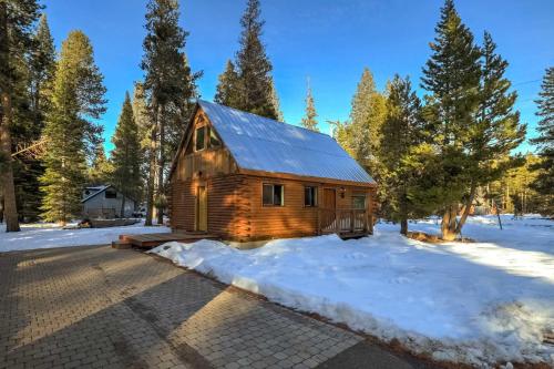 a log cabin in the woods in the snow at Augies Authentic Log Cabin Pets Welcome in South Lake Tahoe