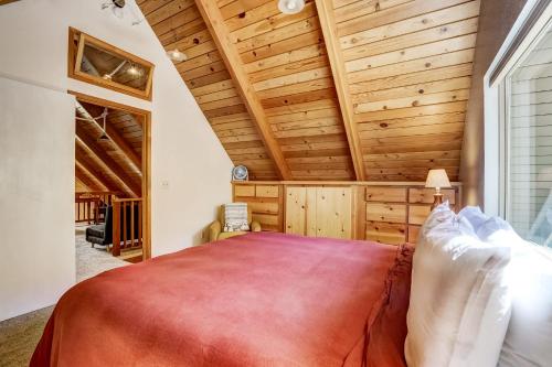 a bedroom with a large bed and wooden ceilings at Rustic Haven - Hot tub & Pet friendly in South Lake Tahoe