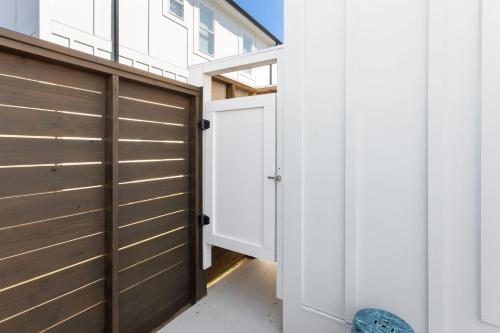 a pivot door in a house with a garage at BCW30A - Waves Inn in Corolla