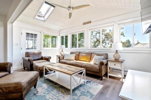 a living room with couches and a table at New Short distance to Ocean in Wells