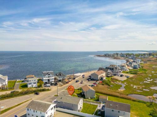 an aerial view of a town and the ocean at 2-Min Walk to Beach Large Deck with Outdoor Sofas in Wells