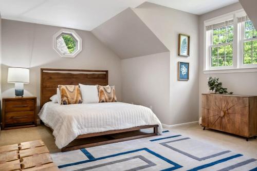 a bedroom with a large bed and a window at Maine Adventure 3BR Oasis Awaits in York