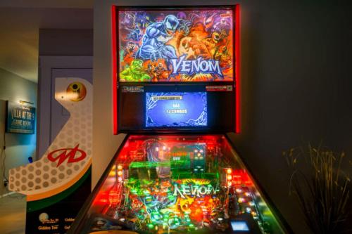 a video game machine in a room with a video game at In-Home Arcade Hot Tub Golf Close to Beach in Old Orchard Beach