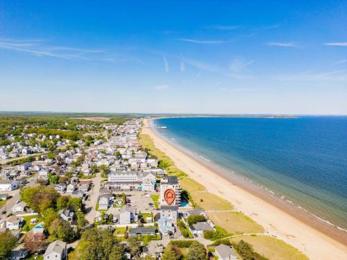 an aerial view of a beach and the ocean at Oceanfront Home Beach Access Deck & Ping Pong in Old Orchard Beach