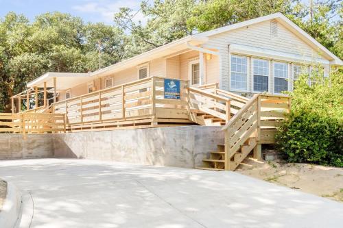a home with a large deck with a house at 8635 - High on the Hill in Frisco