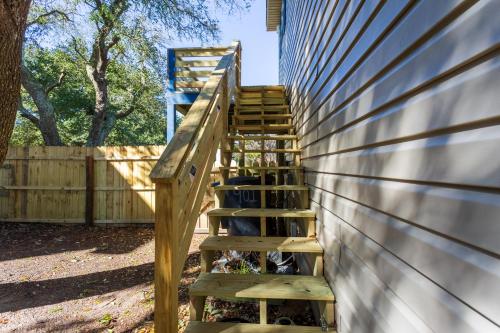 a wooden staircase leading up to a building at 5047 - Sandy Cove OBX in Kill Devil Hills