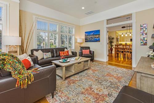 a living room with a couch and a table at Downtown Villa by Paradise Retreats in Santa Barbara