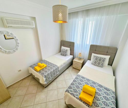 Postel nebo postele na pokoji v ubytování olumpus Apartman Kalkan