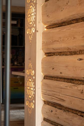 a wooden wall with gold designs on it at Harendzianka in Zakopane