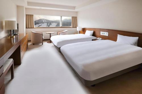 Ένα ή περισσότερα κρεβάτια σε δωμάτιο στο ANA Crowne Plaza Resort Appi Kogen by IHG