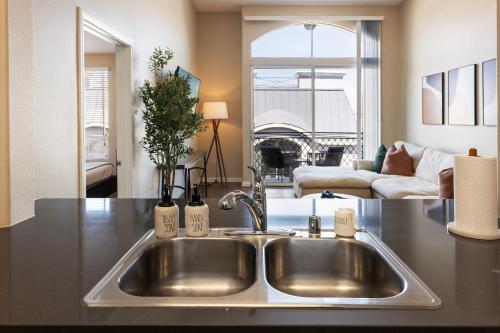 a kitchen with a sink and a living room at Zircon Zen - Quiet retreat 2BR Pool, Jacuzzi Marina in Los Angeles