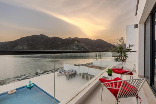 a balcony with a view of the water at Al Dana Sea Luxury Villa Fujairah in Sharm