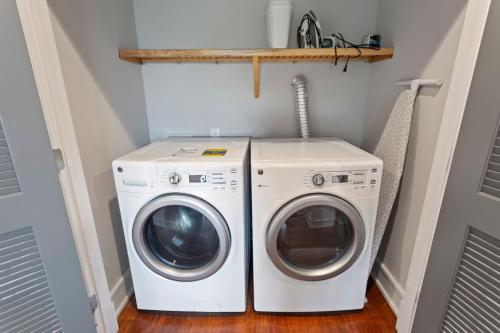a washer and dryer in a laundry room at 1617 - Point Break in Corolla