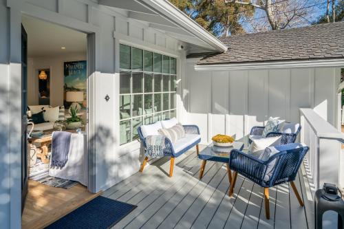 a porch with chairs and a table on a house at Casa Miramar by Paradise Retreats in Montecito