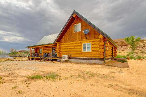 a wooden cabin in the middle of the desert at Explore Uintah Basin Rustic Cliff Cabin with Loft in Fort Duchesne