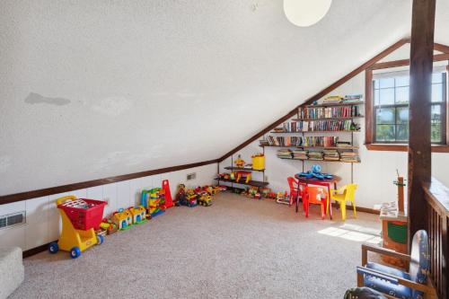 a attic room with toys and a book shelf at 2029 - Duck Yeah in Duck