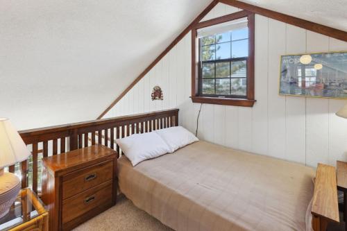 a bedroom with a bed and a window at 2029 - Duck Yeah in Duck