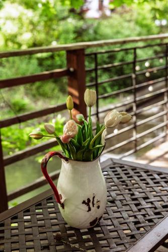 a vase with flowers in it sitting on a table at Willa pod Jemiołą in Wisła