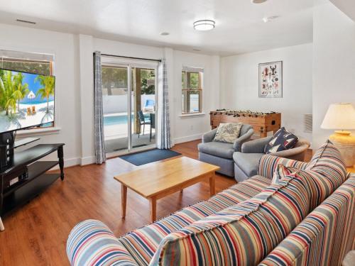 a living room with a couch and a table at 2072 - Laughing Duck in Duck