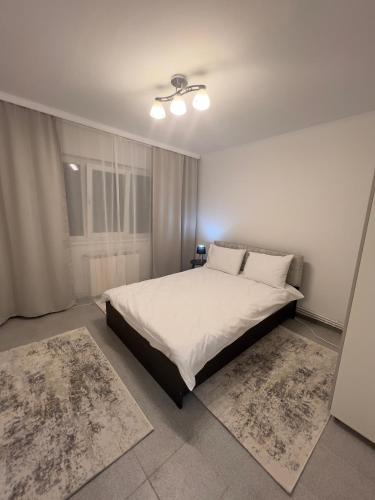 En eller flere senge i et værelse på BeachLuxe Andreea - 5 min to beach