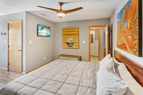 a bedroom with a bed and a ceiling fan at 2067 - Duck Days in Duck