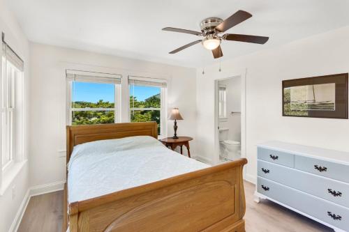 a bedroom with a bed and a ceiling fan at 3018 - Celestial Mermaid in Southern Shores