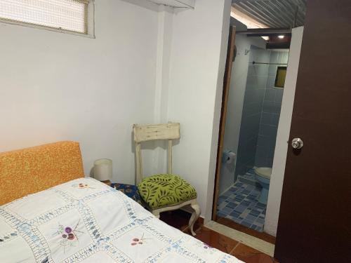 Un Café en el camino Guest Houseにあるベッド