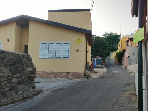 a building with a window on the side of a street at Casa GRAZIA in Reggio Calabria