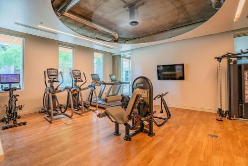 a gym with several exercise bikes and treadmills at Spacious 2BR Apt with Gym Pool Parking in Phoenix