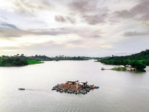 a group of boats in the water on a river at Pousada Pinima Xperience in Goianesia do Para