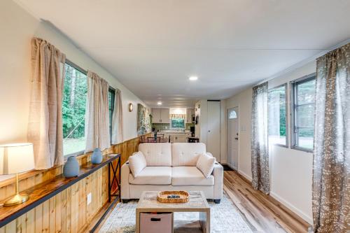 a living room with a couch and a table at Snowmobile and ATV Trails On-Site Adirondacks Abode in Greig