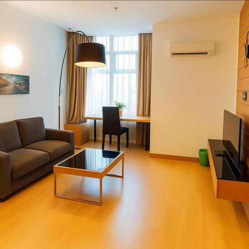 a living room with a couch and a coffee table at KL Sentral Dua Sentral Cozy Homestay Apartments by Hollywood Homes #FreeCarPark in Kuala Lumpur