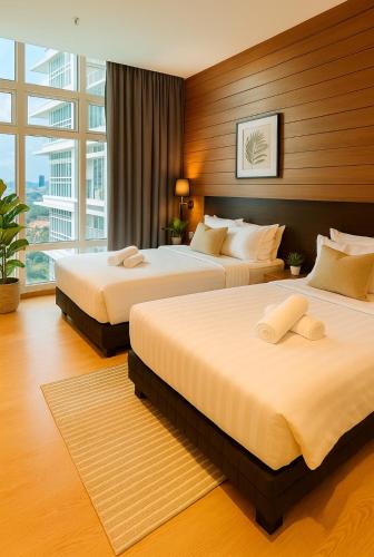 a hotel room with two beds and a large window at KL Sentral Dua Sentral Cozy Homestay Apartments by Hollywood Homes #FreeCarPark in Kuala Lumpur