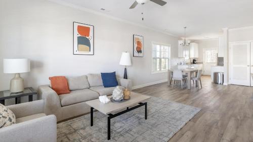 a living room with a couch and a table at Landing Beautiful 1BD Clubhouse Pool in Owens Cross Roads