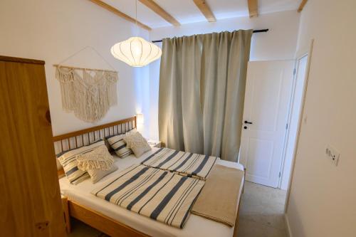 Ένα ή περισσότερα κρεβάτια σε δωμάτιο στο Island home Servantesa
