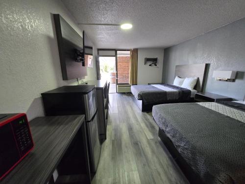 Ένα ή περισσότερα κρεβάτια σε δωμάτιο στο Stay Inn - Bartow