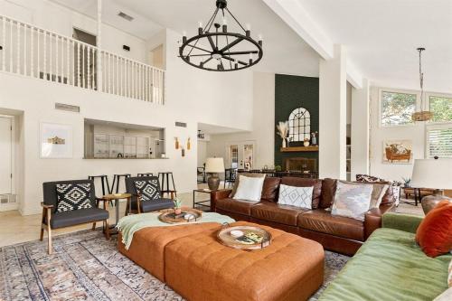a living room with a couch and a table at Pool! Games! Dogs! Space! in San Antonio