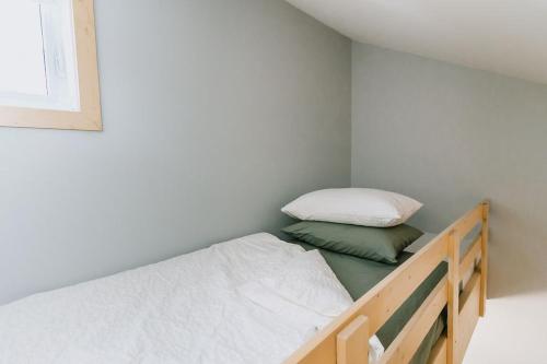 a small bedroom with a bunk bed in a room at Adventure Knap Shack in Nordegg