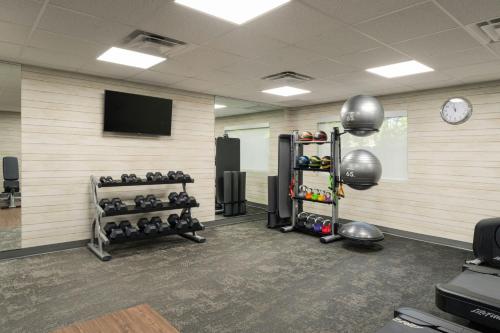 a gym with several racks of weights and a tv at Fairfield Inn Tallahassee North/I-10 in Tallahassee