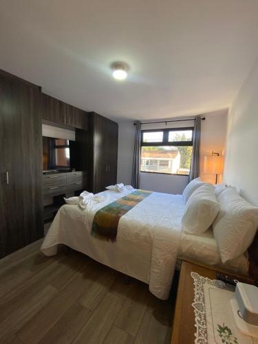 Ένα ή περισσότερα κρεβάτια σε δωμάτιο στο Petapolis apartment
